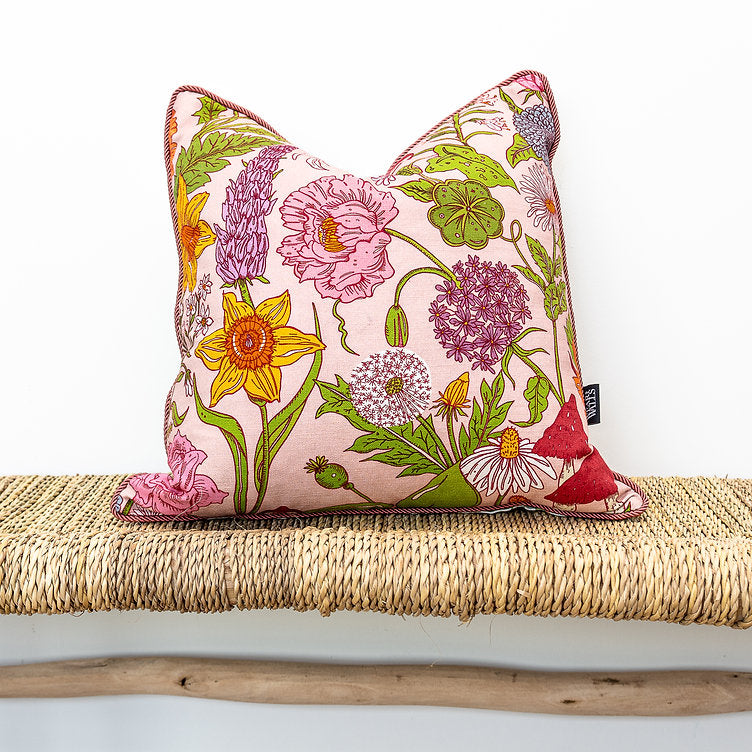 wear-the-walls-medium-reversible-linen-cushion-in-bloom-sonder-pink-floral-bright-florals-on-white-linen-pipped-trim  