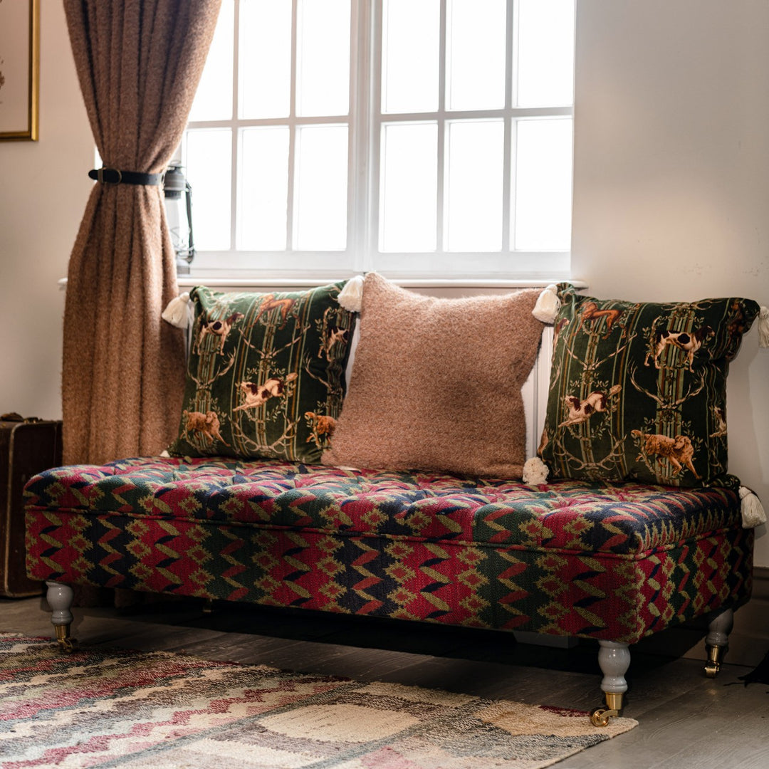 mind-the-gap-Tyrol-collection-Saray-jacquard-red-blue-green-gold-castor-legs-tufted-ottoman-footstool-winter-apres-ski-chalet-cabin-style-nordic 