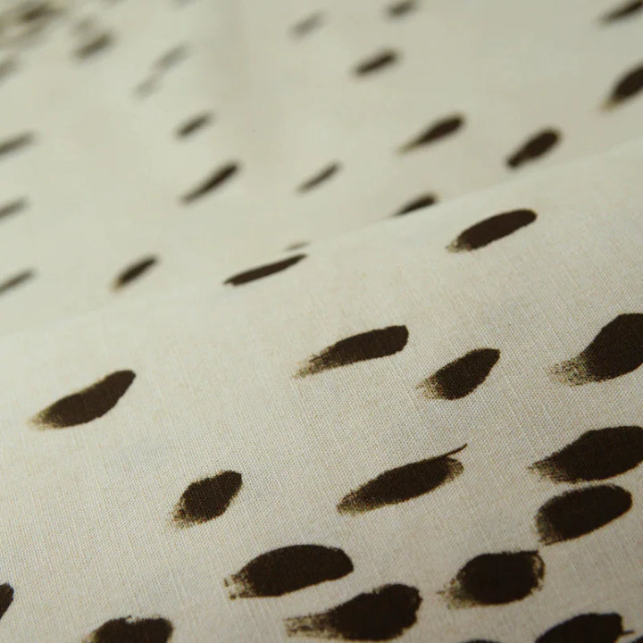 Poodle-and-blonde-Tottenham-Dalmatian-printed-animal-pattern-black-spots-on-white-linen-cotton-linen-90-10-digitally-printed- brush-stroke-spots