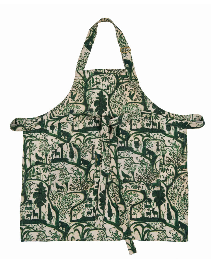 Mind-the-gap-enchanted-woodland-linen-printed-wallpaper-scene-apron-stonewashed-wolves-birds-trees-woodland-forest-green-on-cream