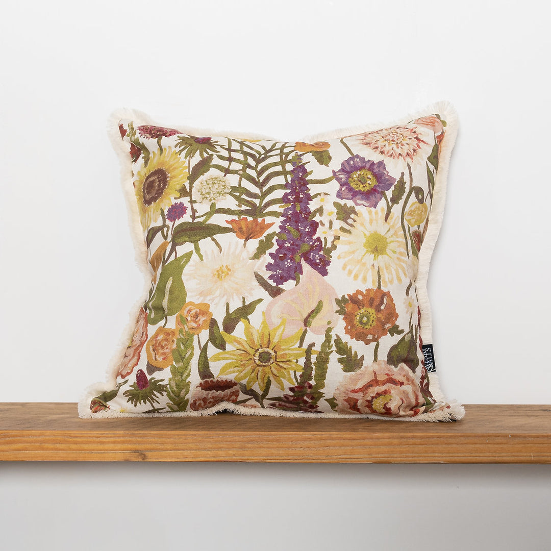 wear-the-walls-medium-linen-cotton-cushion-fringed-painterly-print-floral-blooms-Utopia-Opal-soft-pastel-brown-purple
