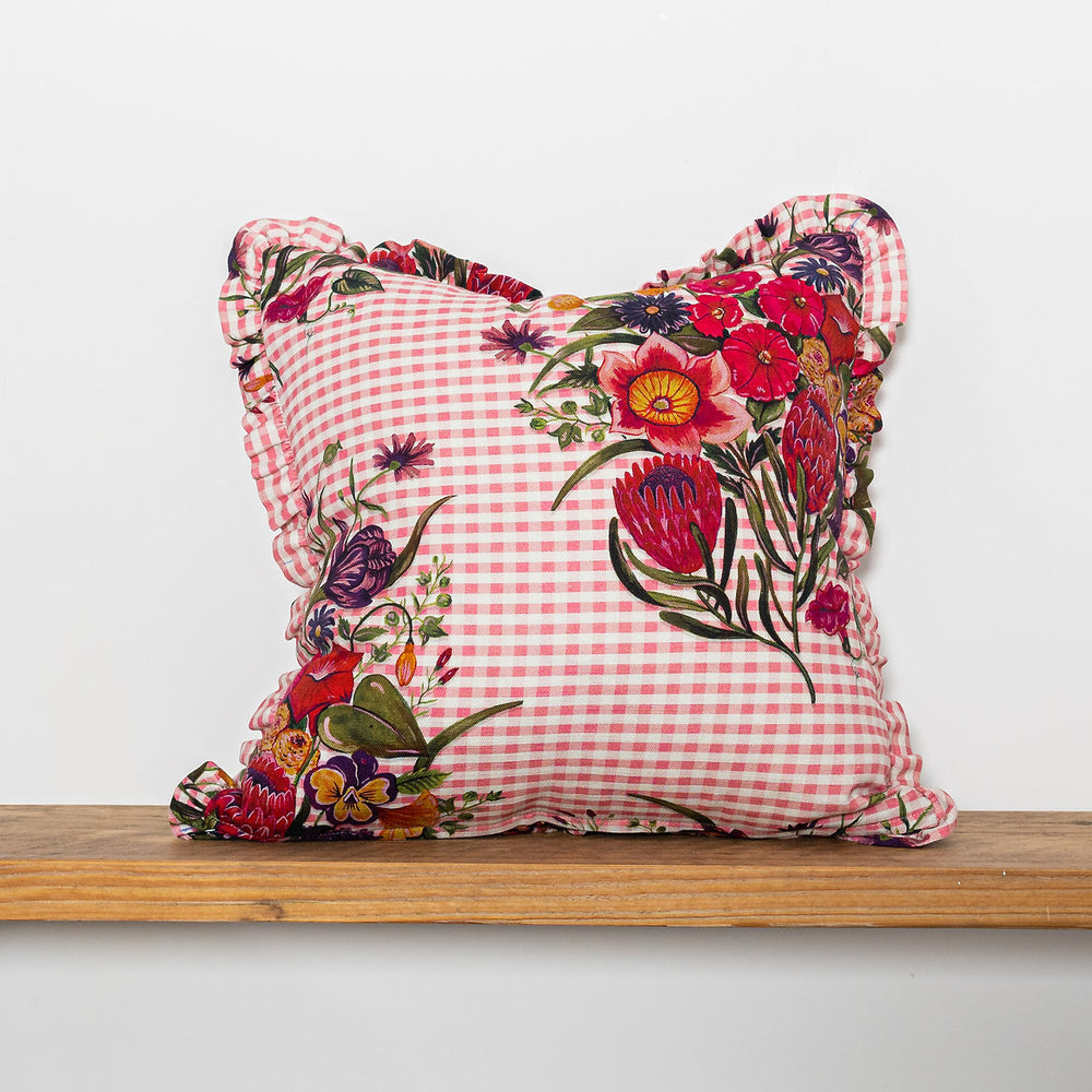 Wear-the-walls-linen-frilled-cushion-in-posy-cheery-gingham-frilled-cushion-large-floral-secondary-print-bold-print-hand-illustrated-lonen-cotton-mix-frill-detail-edges-made-in-england
