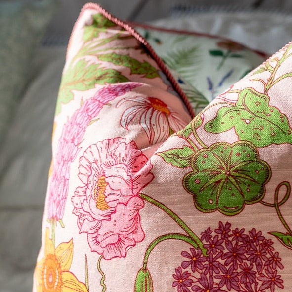 wear-the-walls-medium-reversible-linen-cushion-in-bloom-sonder-pink-floral-bright-florals-on-white-linen-pipped-trim