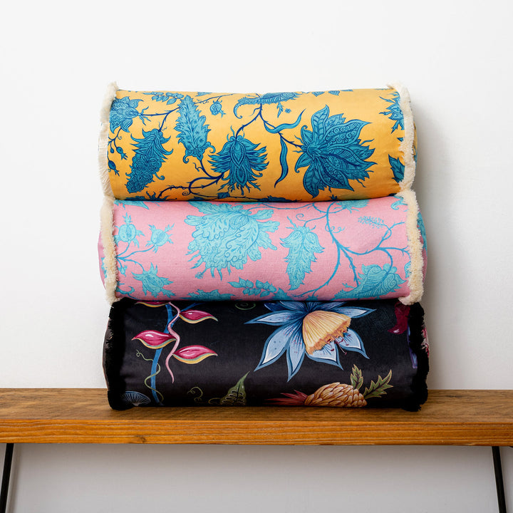 wear-the-walls-bolster-cushion-in-hermosa-pink-turquoise-vine-printed-velvet-fringed-edges-throw-cushion