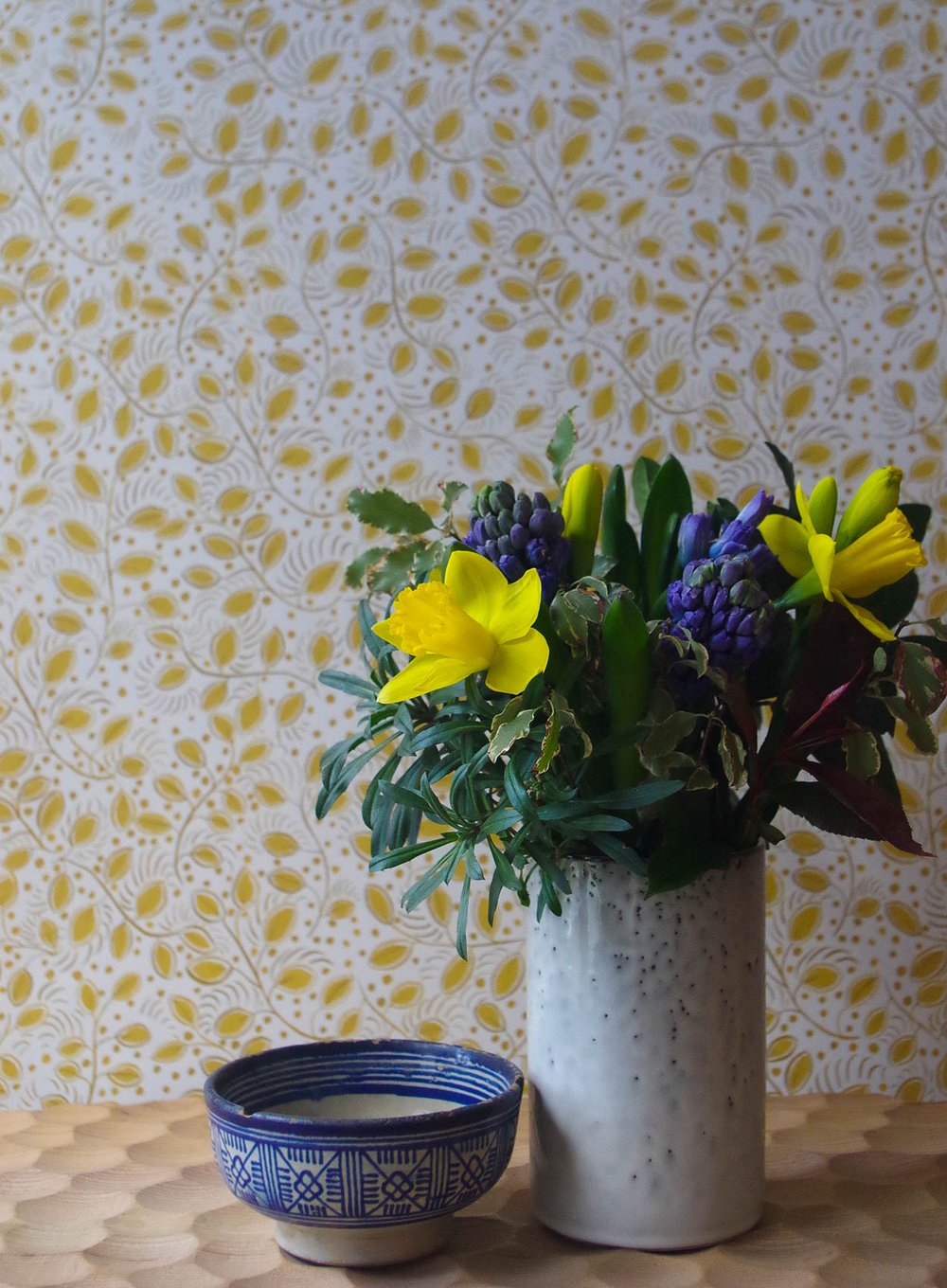 Lowri -Studio-wallpaper-little-leaves-yellow-sunny-yoke-white-fresh-trailing-ditsy-print-eco-substrate-wallpaper-