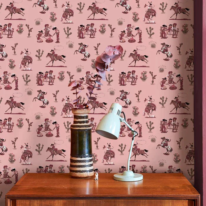 Poodle-and-Blonde-Cliftonville-cowgirls-wallpaper-printed-horses-cowgirls-retro-kitch-wild-west-hand-painted-pattern-Motel-Pink