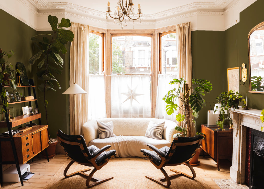 coat-paints-the-tobacconist-laura-jackson-collaboration-earthy-deep-green-lounge-tall-ceilings