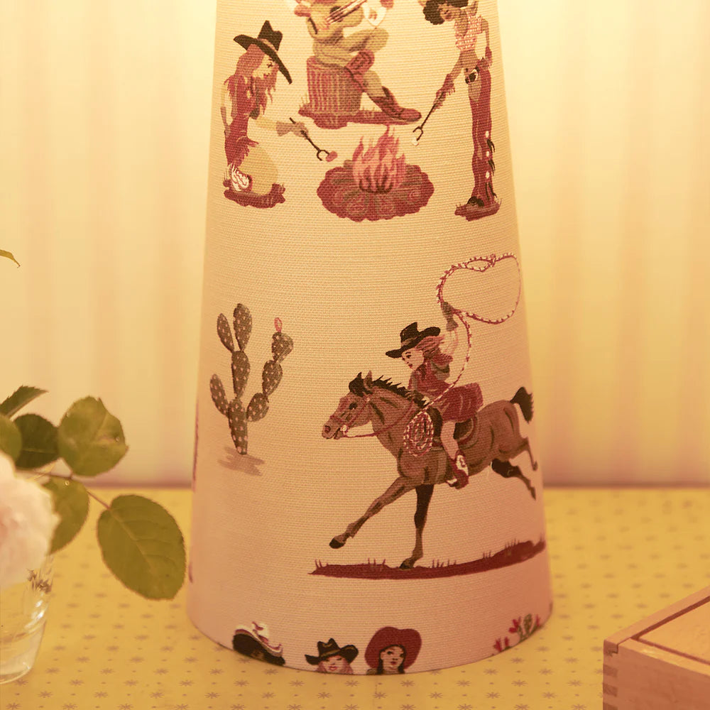 Poodle-and-Blonde-cliftonville-cowgirls-linen-drum-table-lamp-motel-rero-cowboy-hand-painted-design-on-pink-linen-lamp-kitch-cowgirl-print