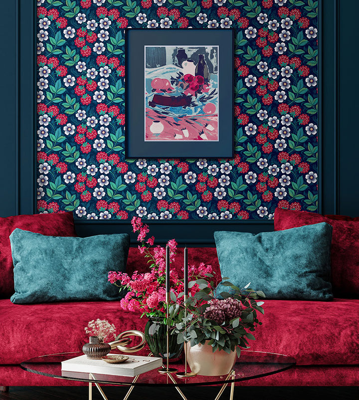 Olenka-wallpaper-raspberry-blues-trailing-raspberry-bushes-against-blue-background-red-berries-white-flowers-greann-leaves-folk-inspired-hand-illustrated