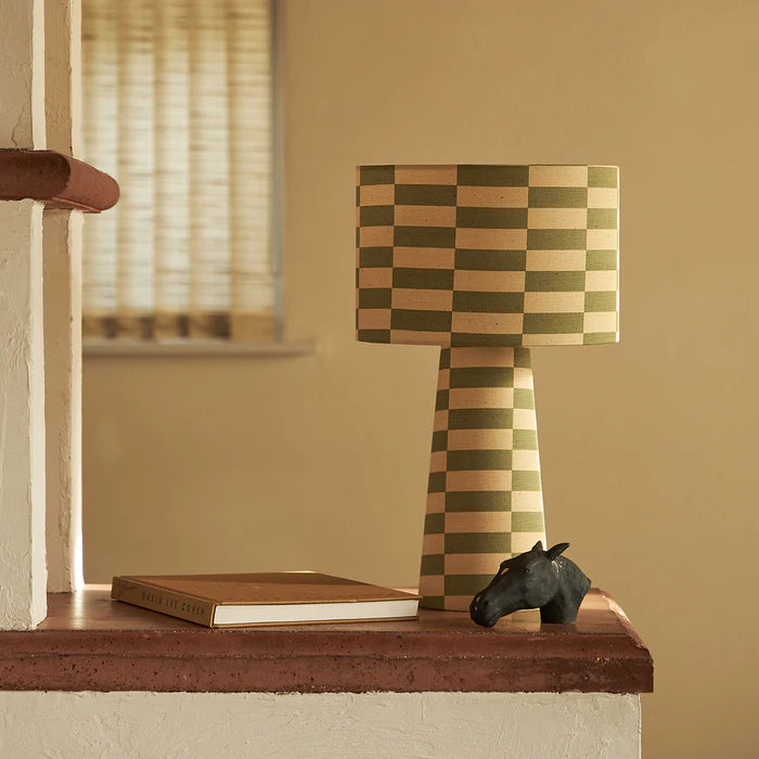 Poodle-and-blond-Tucson-Lullaby-linen-drum-table-lamp-green-cream-blocks-stacked-pattern-retro-vibes-rattlesnake-fabric-linen-simple-styling-table-lamp-linen-base-and-shade