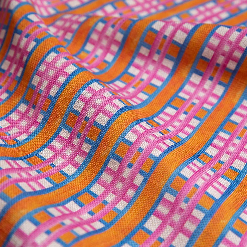 Bethie-tricks-textiles-cheerful-check-blue-white-pink-against-orange-retro-tartan-printed-linen-watercolour-faded-tile-influenced-textile