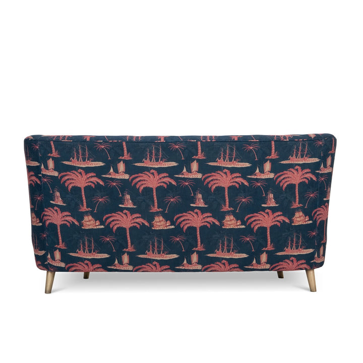 Mind-The-Gap-Venice-Tub-style-curved-sofa-couch-Aegean-linen-red-paln-print-navy-background-ships-trees-buttoned-back-exotic-print-metal-legs-hand-made