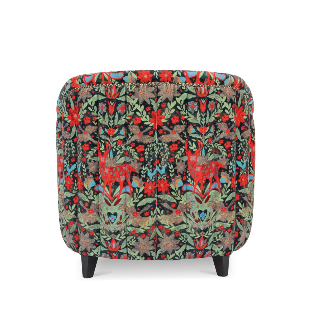 Mind-the-gap-scarlett-chair-der-koning-velvet-tub-chair-leather-studs-wooden-legs-crimson-red-stags-floral-black-plush-background-statement-chair-alpine-vibes-cabin-furniture