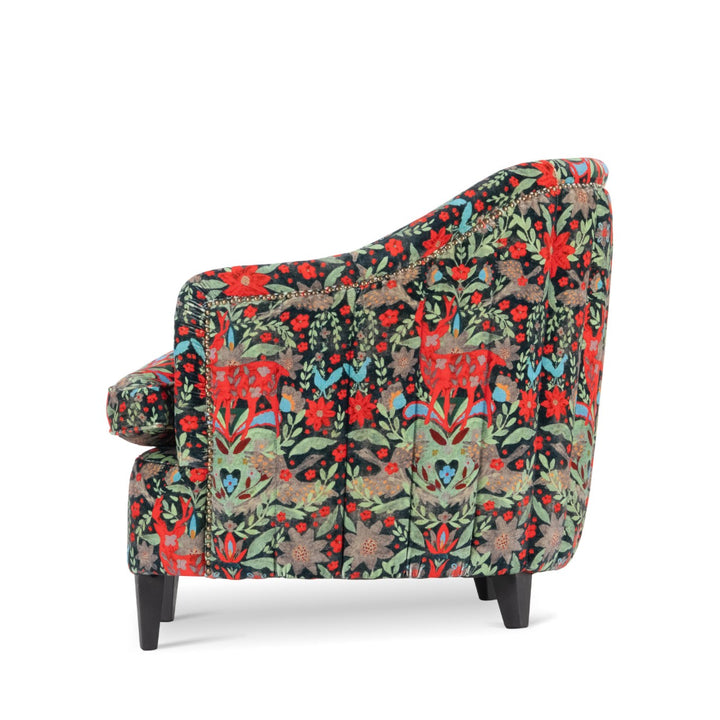 Mind-the-gap-scarlett-chair-der-koning-velvet-tub-chair-leather-studs-wooden-legs-crimson-red-stags-floral-black-plush-background-statement-chair-alpine-vibes-cabin-furniture