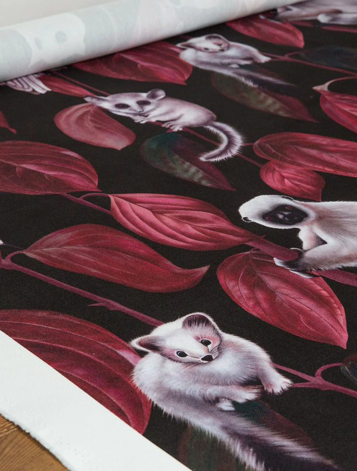 witch-and-watchnman-siberia-fabric-mysterious-creatures-red-vine-leaves-animals-vole-monkey-squirrels-owls-illustrated-fabric-blackdark-background