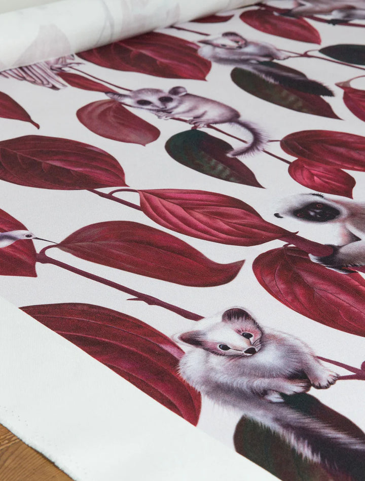 witch-and-watchnman-siberia-fabric-mysterious-creatures-red-vine-leaves-animals-vole-monkey-squirrels-owls-illustrated-fabric-light-white-background-red-green-black-print