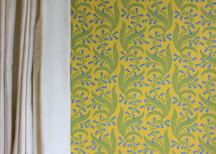 Ellen-merchant-bluebells-Butter-wallpaper-yellow-base-colour-paper-blue-green-flowers-block-printed-british-designer