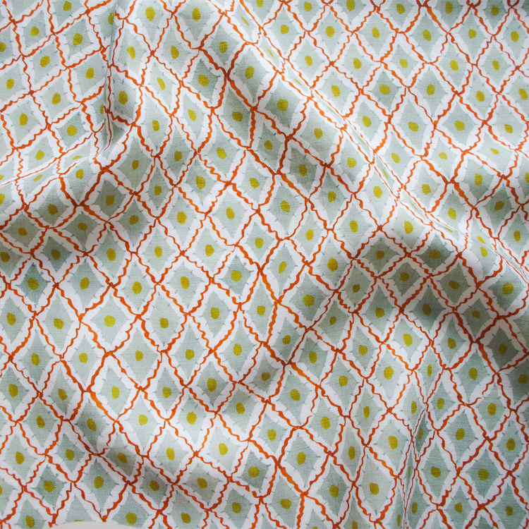 Lowri-textiles-diamond-harlequin-fabric-printed-blockprinted-green-red-yellow-fabric-cotton-linen-diamond-ditsy-pattern