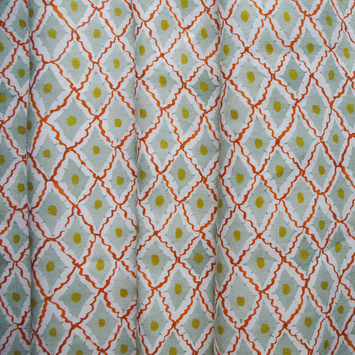 Lowri-textiles-diamond-harlequin-fabric-printed-blockprinted-green-red-yellow-fabric-cotton-linen-diamond-ditsy-pattern