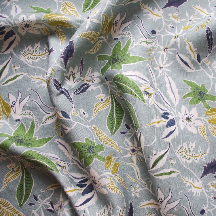 lowri-textile-jasmine-and-clematis-floral-textile-fabric-trailing-vines-flowers-blue-yellow-green-soft-blue-navy-linen-fabric-british-printed-pattern-