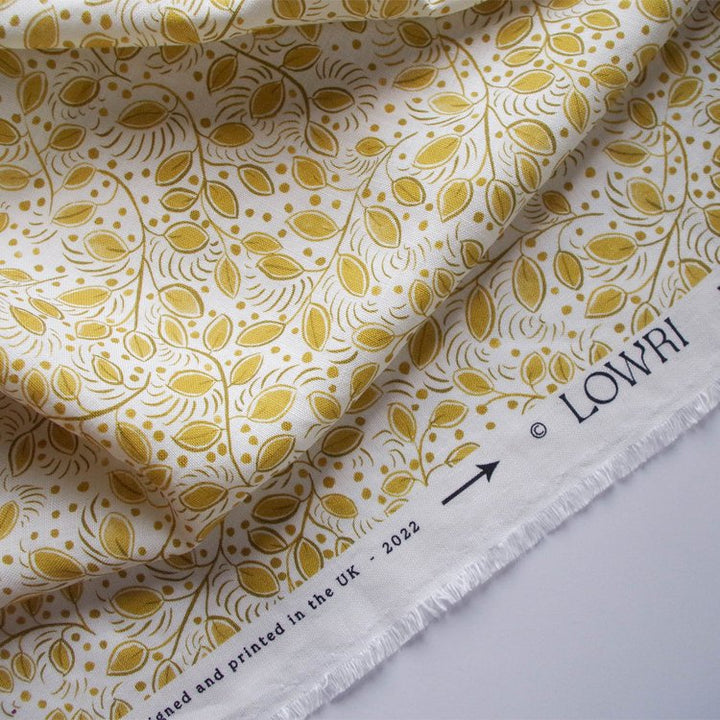 Lowri-textiles-linen-leaf-leaves-trailing-ditsy-print-little=leaves-yellow-upholstry-textile-fabric-blinds-curtains-floral-small-printed-white-yellow-