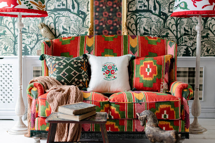 abigail-mind-the-gap-sofa-multi-coloured-linen-fabric-green-fringing-ikat-print-design-floorlamp-lounge-set-green-wallpaper-panelling-red-green-room-set