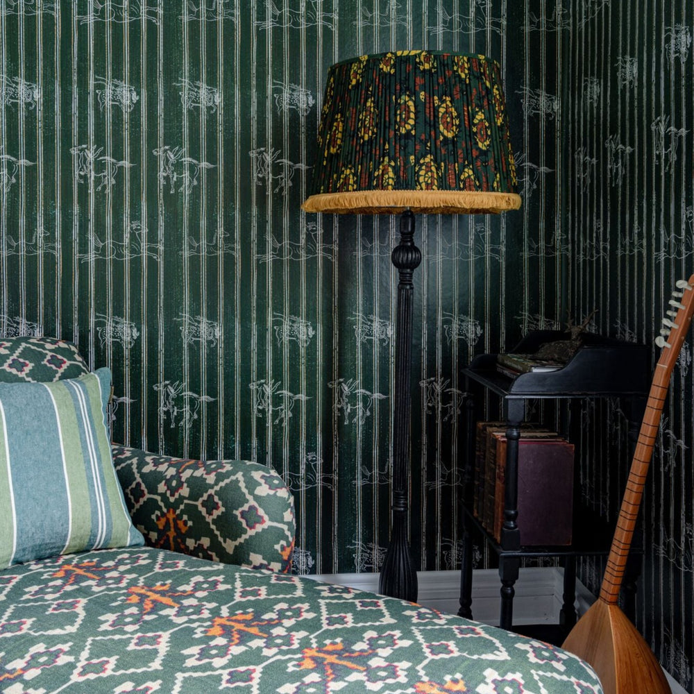 green-stripe-wallpaper-horses-lampshade-chaise-lounge-mind-the-gap-a-fable-indigo-wallpaper-transylvanian-roots-collection-maximalist-statement-interior