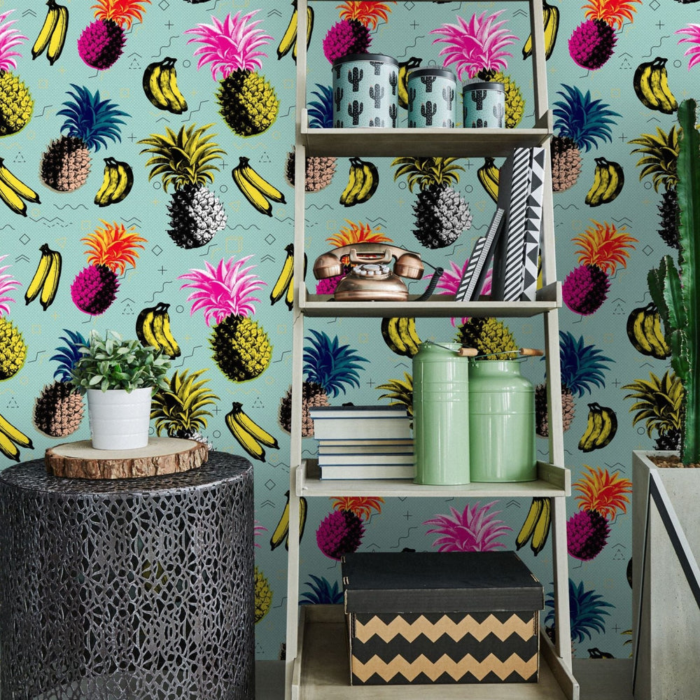 mind-the-gap-flying-objects-blue-wallpaper-nouvelle-pop-collection-vibrant-pop-art-inspired-tropical-fruits-banana-pineapple-colourful-maximalist-statement-interior