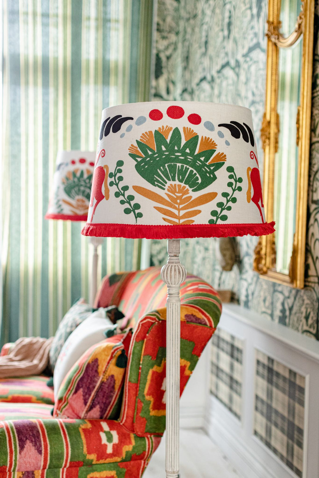 embroidered cone lampshade horse and flowers folk design red white and green with fringe floor lamp sofa room set